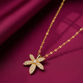 Floral gold-tone artificial pendant necklace with sparkling stones by Evah Jewels
