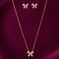 gold-tone butterfly pendant necklace and matching crystal butterfly stud earrings set for women, featuring sparkling white stones on burgundy satin by Evah Jewels.