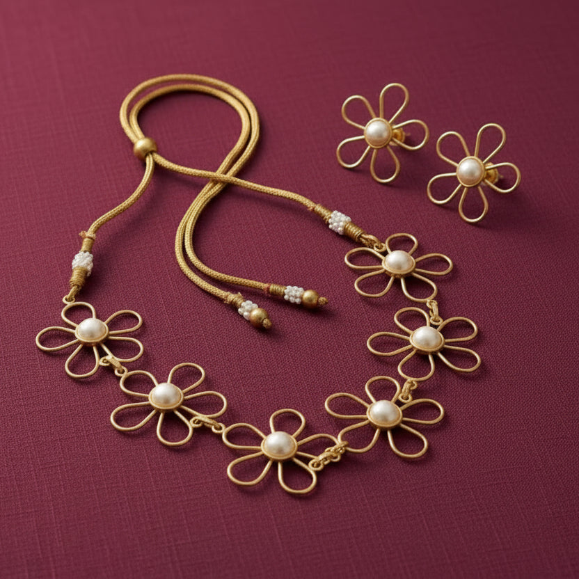 gold-tone floral necklace and matching flower stud earrings set for women, featuring open-petal daisy designs, white pearl centres and an adjustable cord by Evah Jewels.