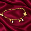 Discover effortless elegance with the EVAH JEWELS Gold Tone Heart and Pearl Charm Bracelet for Women, a beautifully designed fashion jewellery accessory featuring a delicate gold-tone chain link design adorned with charming decorative elements. This stylish bracelet showcases a polished gold heart charm embellished with sparkling white stones, two elegant white pearl-style drops, a beautiful star charm and a small round gold-tone charm. The combination of modern chain links, feminine pearl detailing and pla