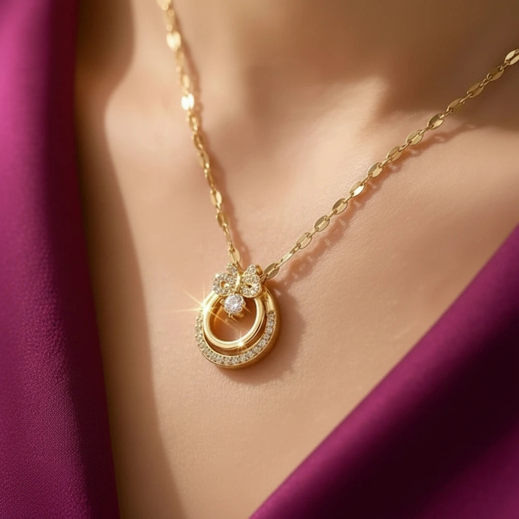 Gold-plated imitation jewellery pendant necklace with sparkling stones and floral design by Evah Jewels.
