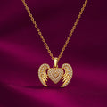 Gold-tone imitation jewellery necklace with a sparkling heart pendant and decorative wing design by Evah Jewels