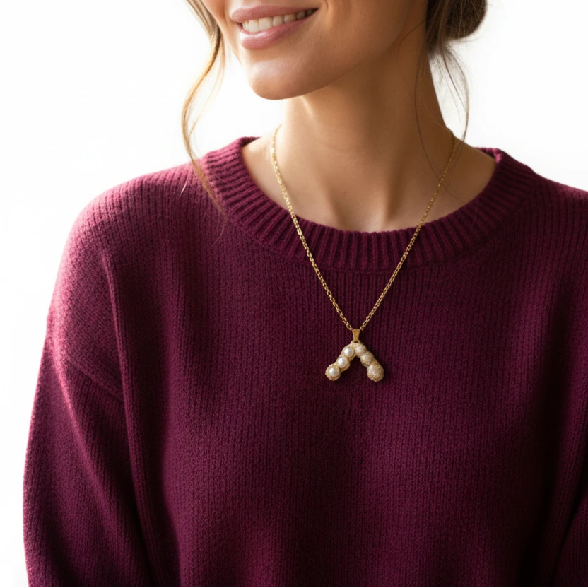 Gold-tone artificial jewellery necklace with a pearl and crystal-studded pendant by Evah Jewels