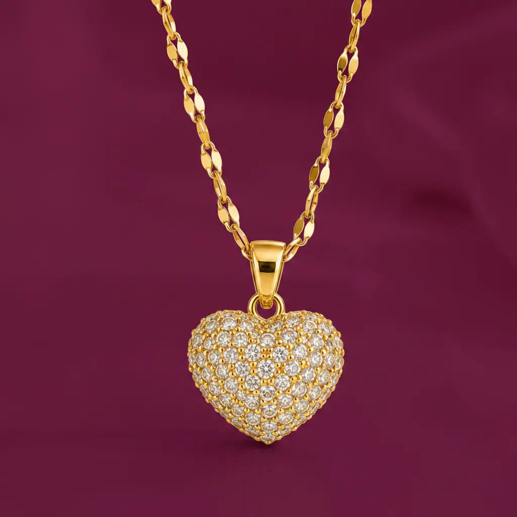 Gold-tone imitation jewellery necklace with a heart-shaped pendant covered in sparkling stones by Evah Jewels