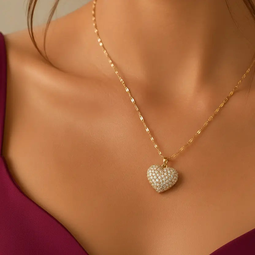 Gold-tone imitation jewellery necklace with a heart-shaped pendant covered in sparkling stones by Evah Jewels