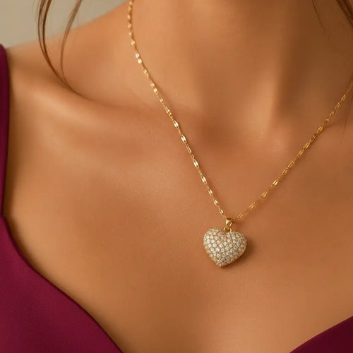 Gold-tone imitation jewellery necklace with a heart-shaped pendant covered in sparkling stones by Evah Jewels
