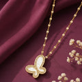 Gold-tone imitation jewellery necklace with a butterfly-shaped white pendant and sparkling stone detailing by Evah Jewels