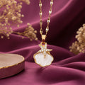 Gold-tone imitation jewellery necklace with a white shell-style pendant and sparkling star design by Evah Jewels