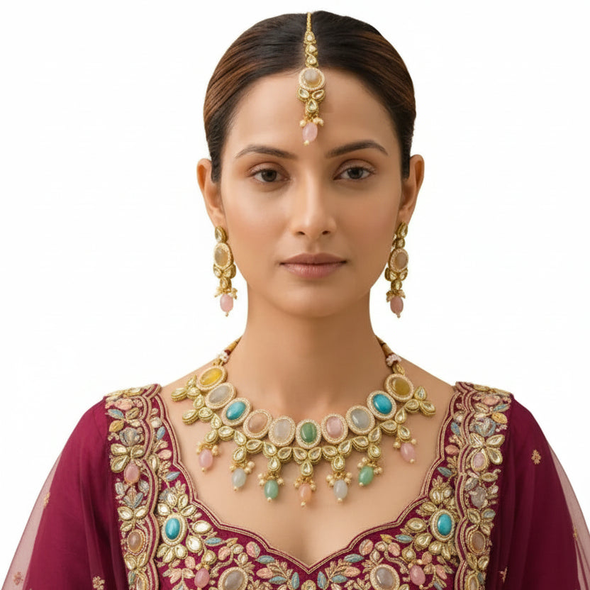 Woman wearing EVAH JEWELS multicolour pastel Kundan necklace set with matching dangling earrings and maang tikka, styled with an embroidered burgundy bridal lehenga.